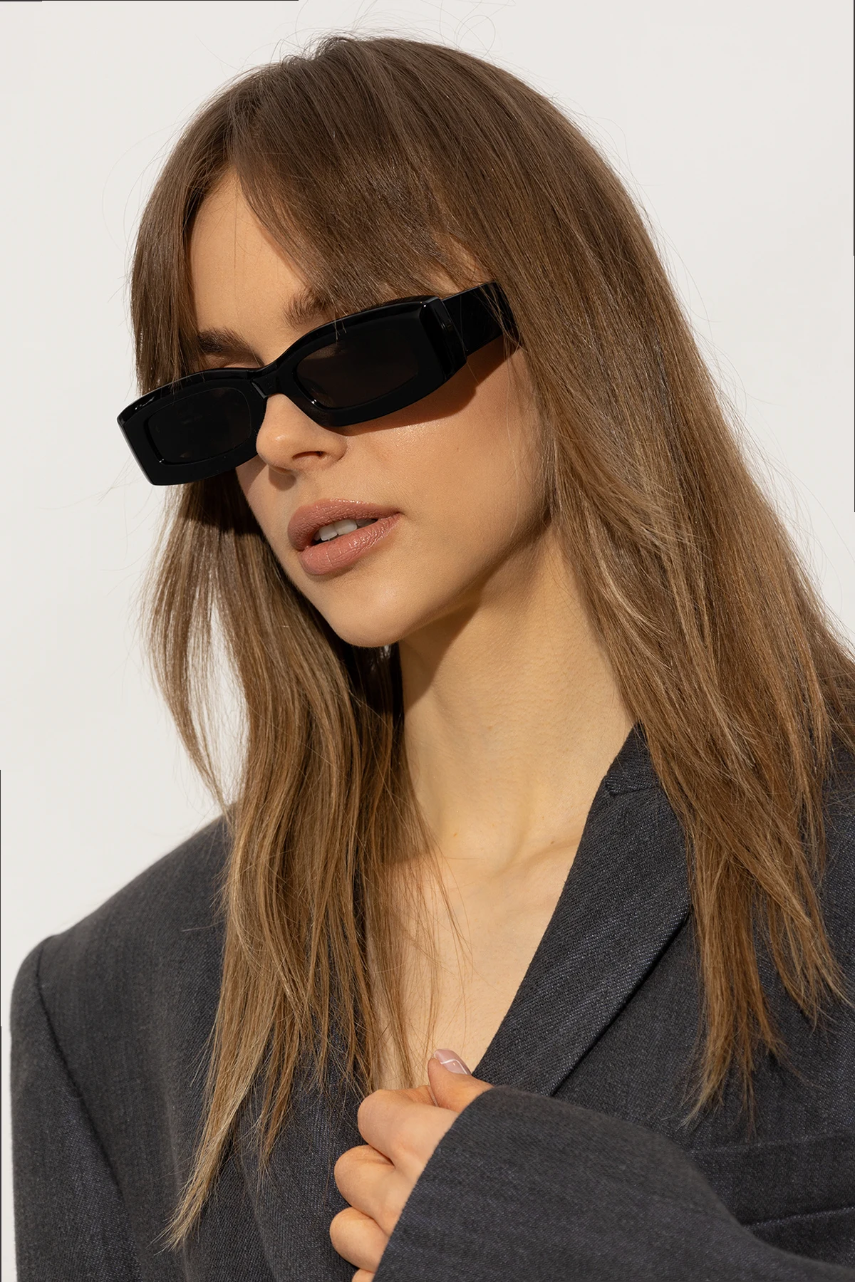 Sunglasses with logo-engraved eyelet
