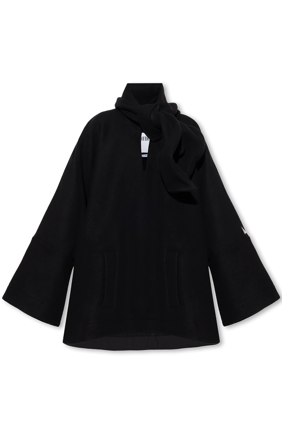 Poncho with decorative fastening