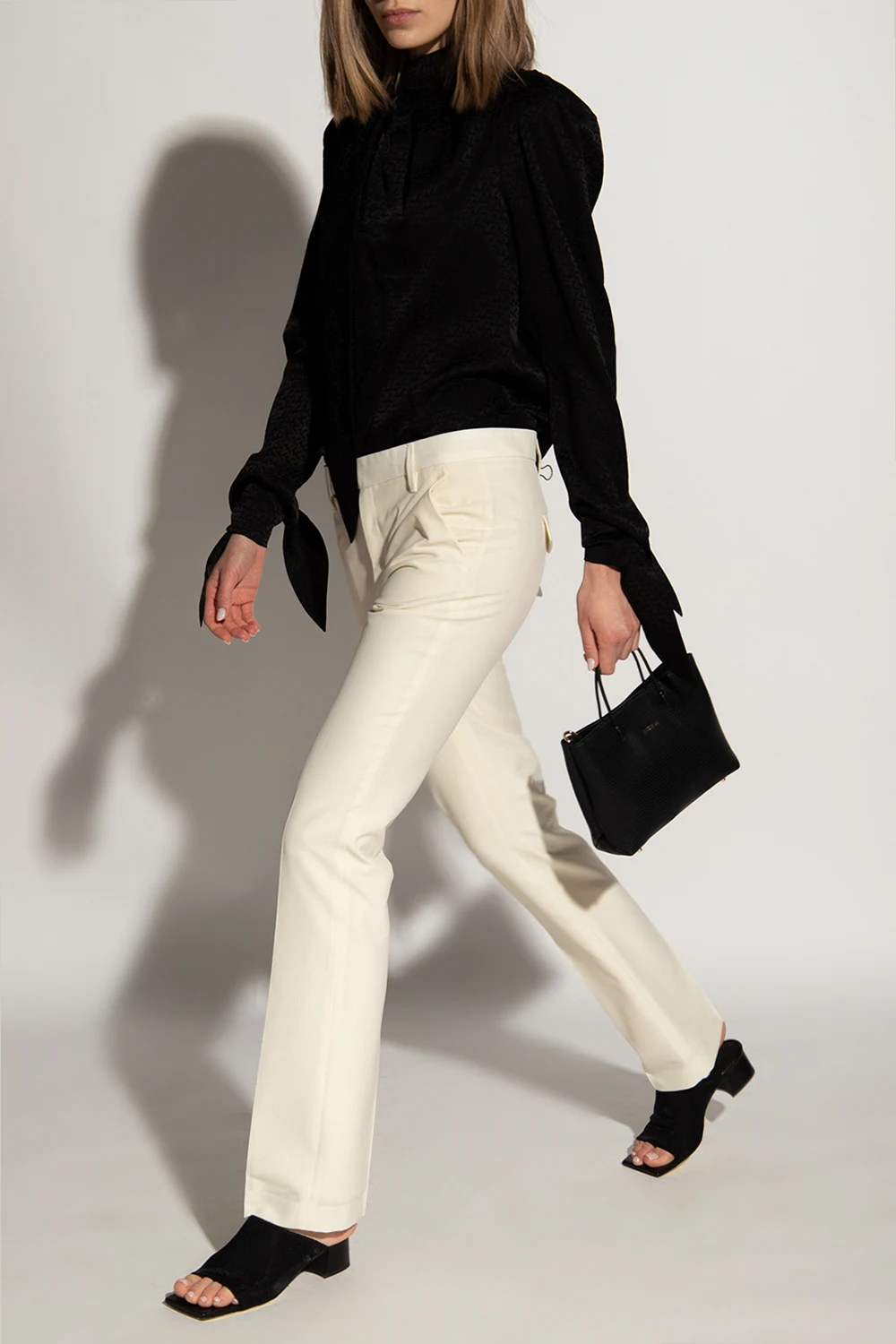 Pleat-front trousers with cut-out