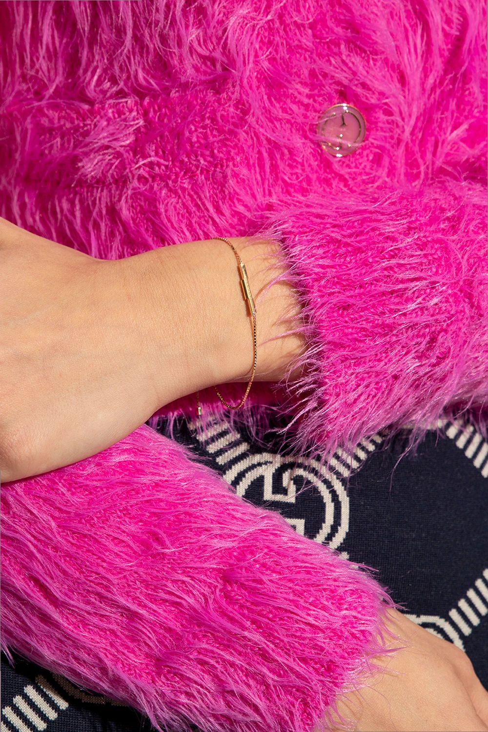 Gold bracelet with logo