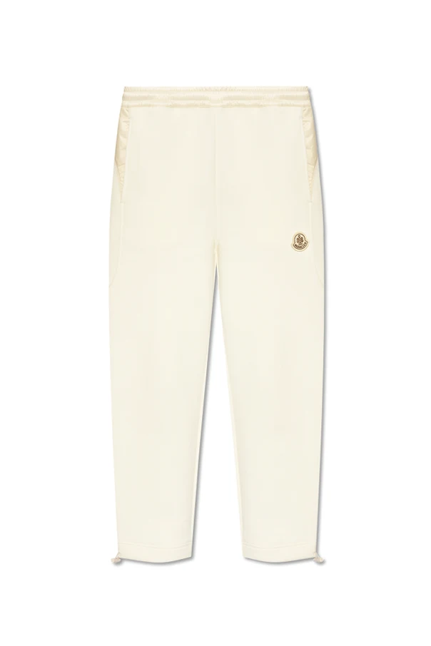 kremowy Spodnie dresowe z naszywką z logo