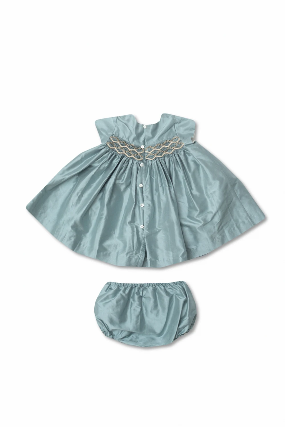 Dress with decorative trims