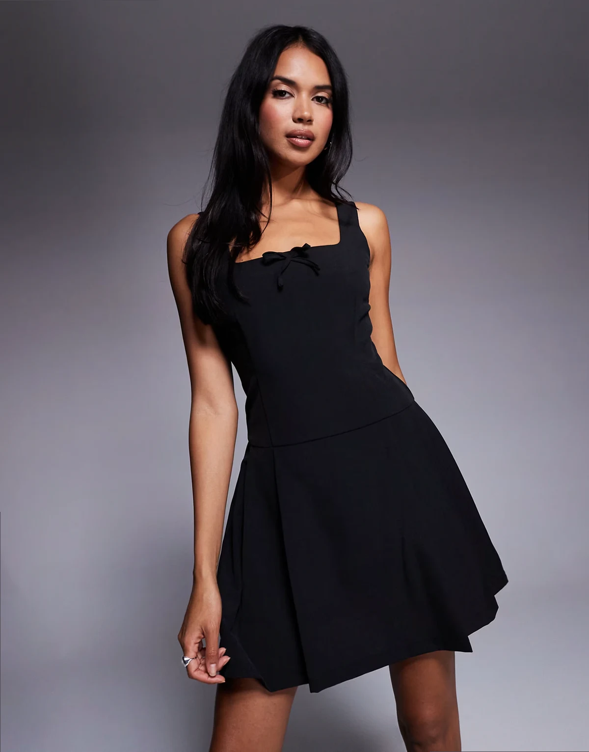 square neck pleated mini dress with bow detail in black