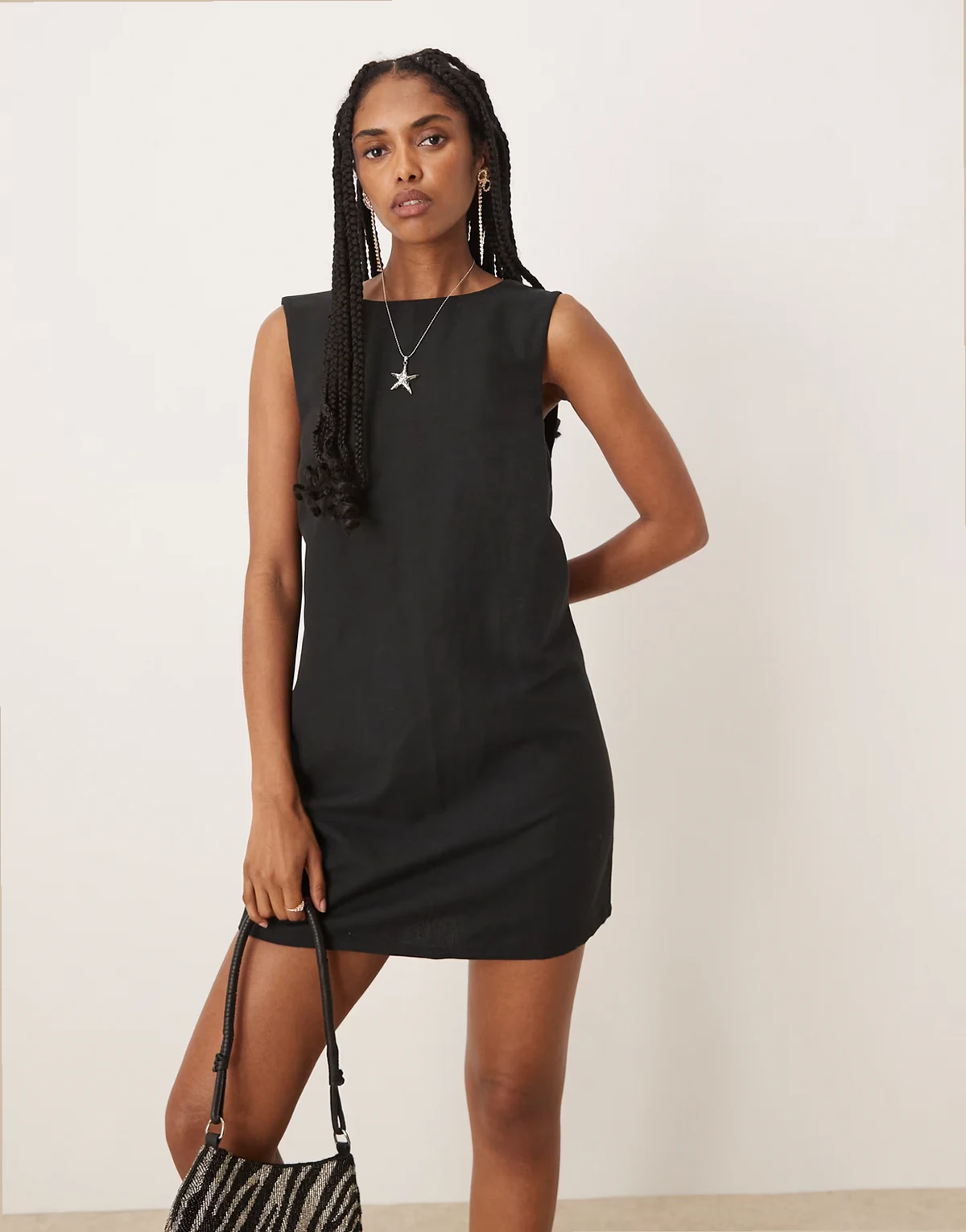 reversible button back mini shift dress in black