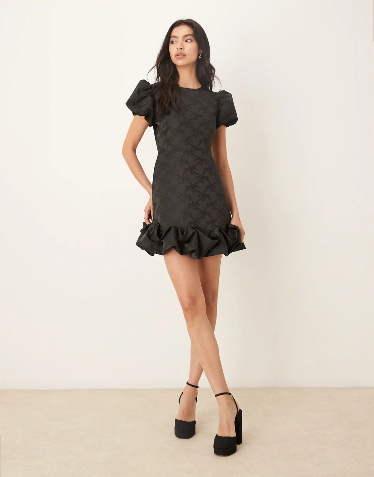 puff sleeve ruffle hem mini dress in black bow print