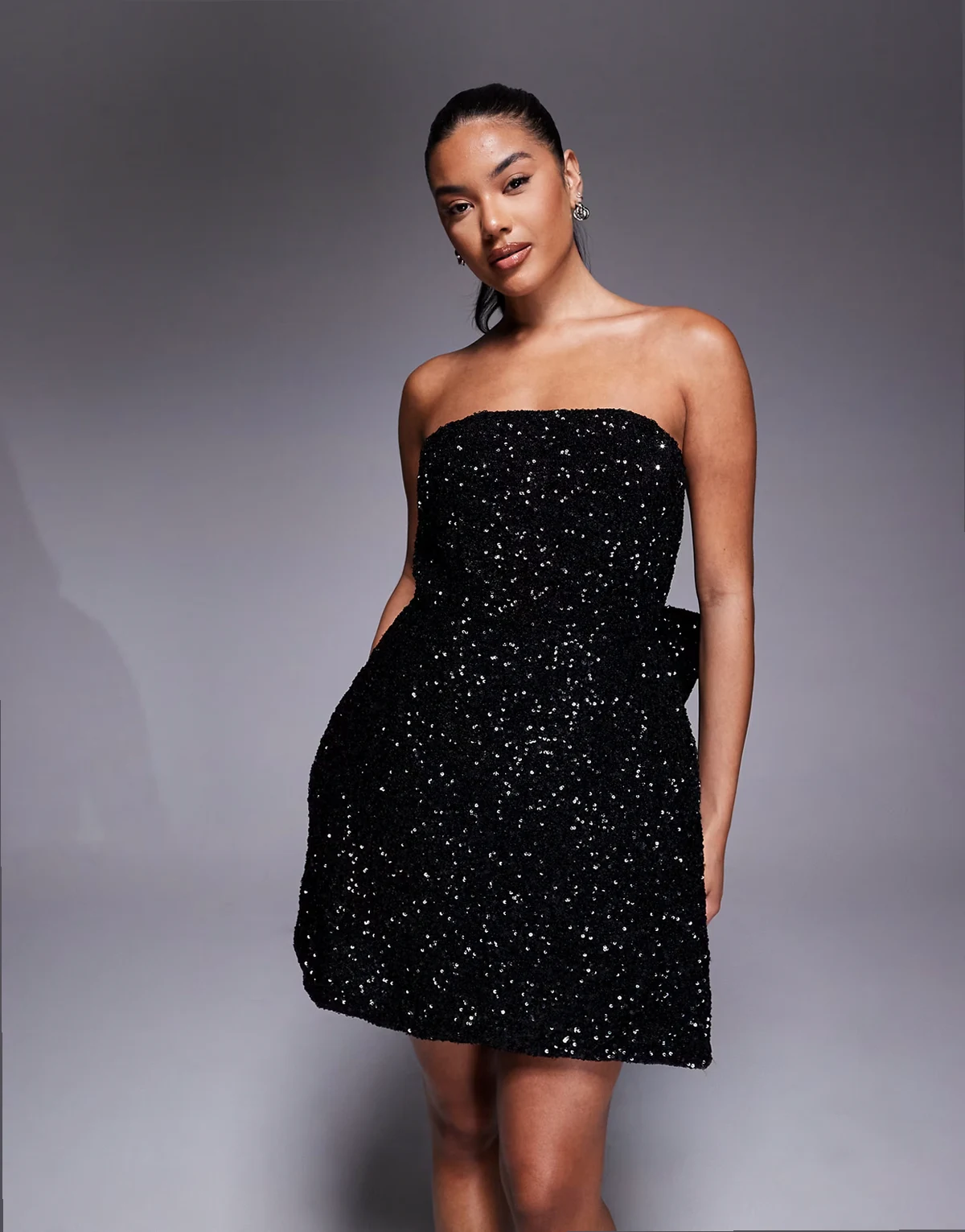 sequin structured mini dress with bow back in black