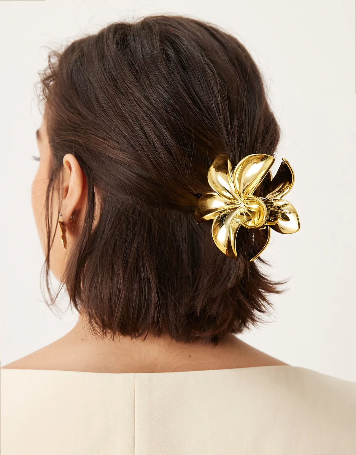 plumeria metallic hair claw in gold tone