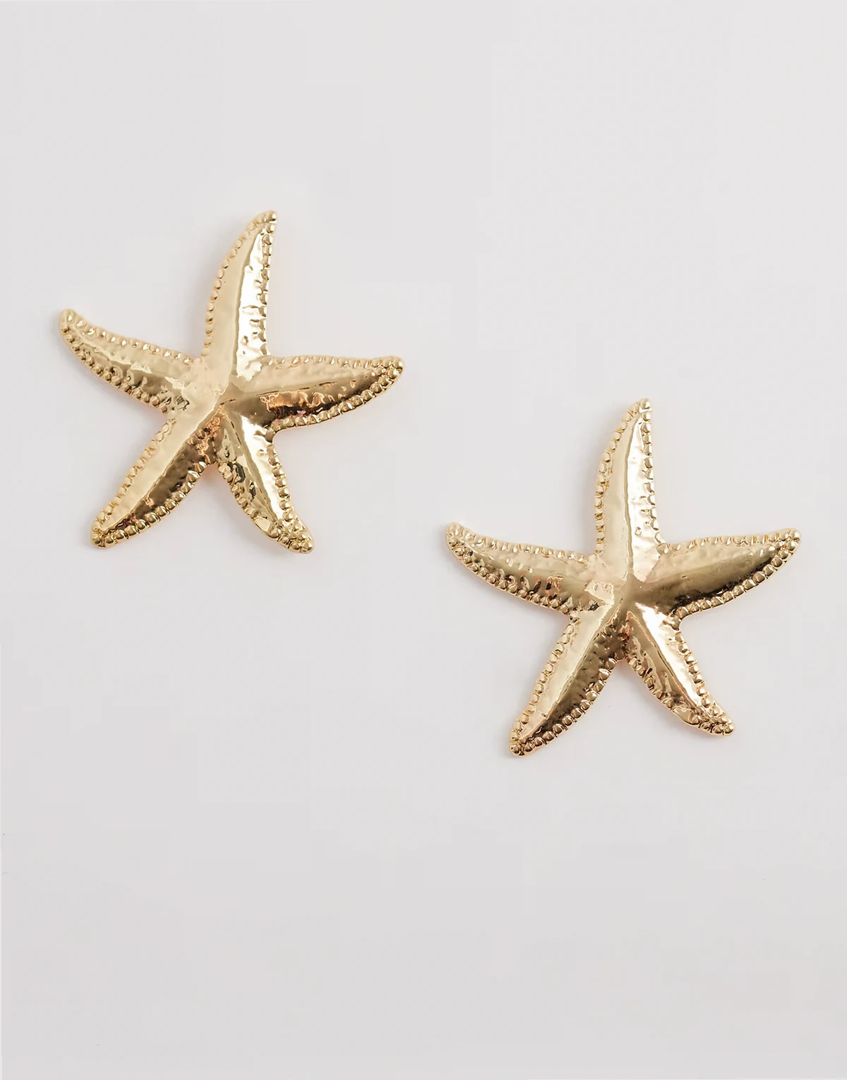 statement starfish earrings in gold tone