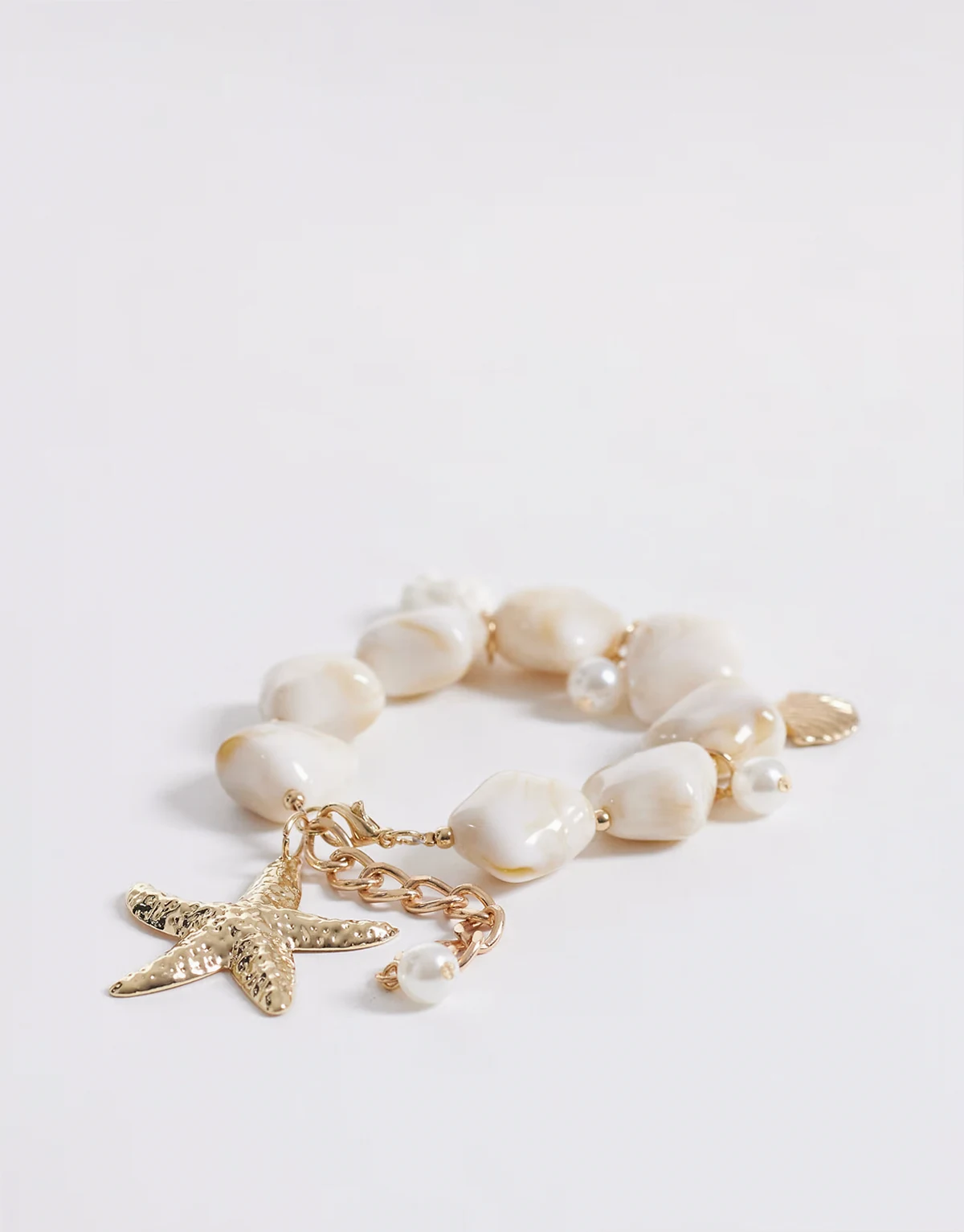 – Bransoletka w złotym kolorze złota z kamieniami i zawieszką z rozgwiazdą