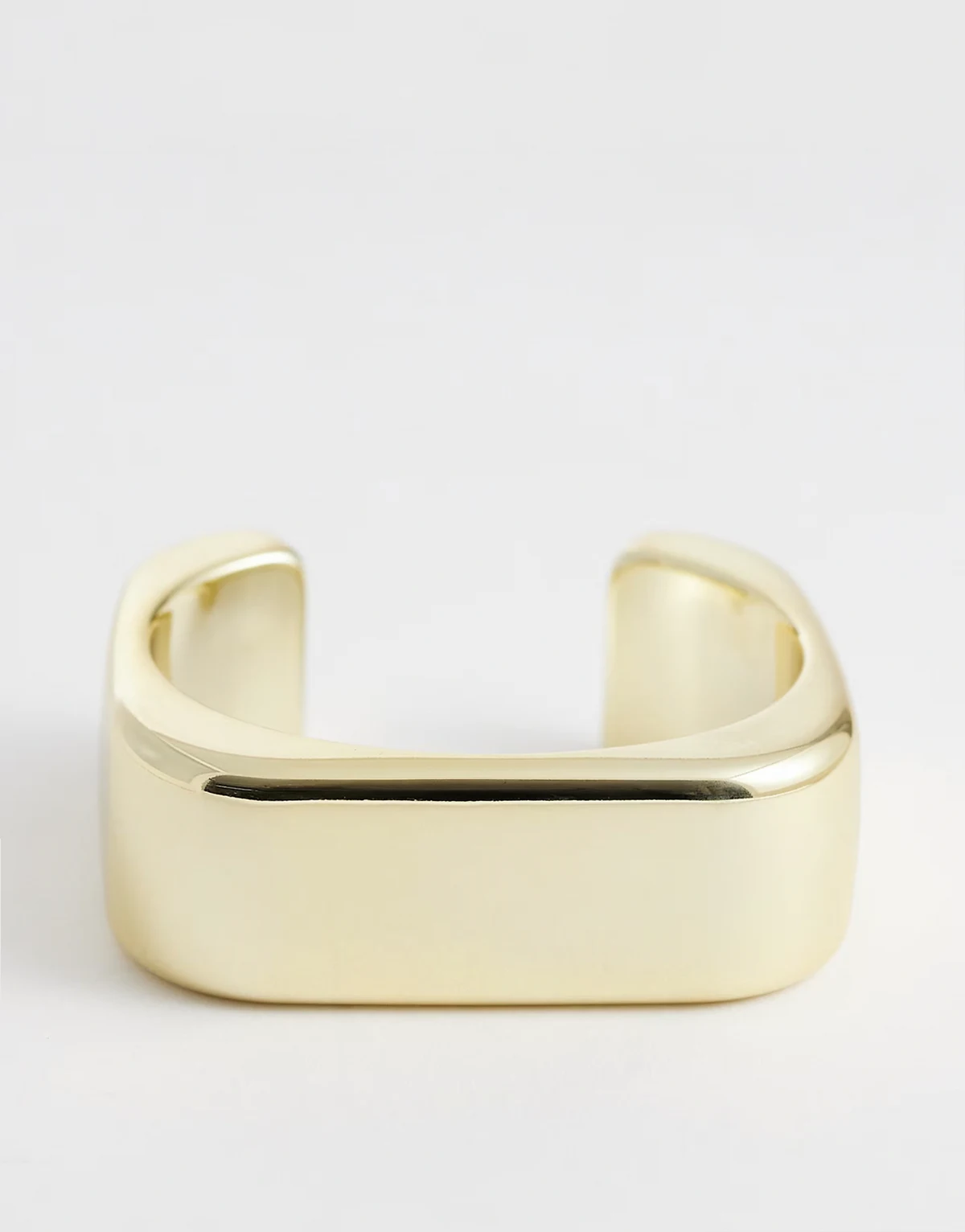 open bangle bracelet in gold tone