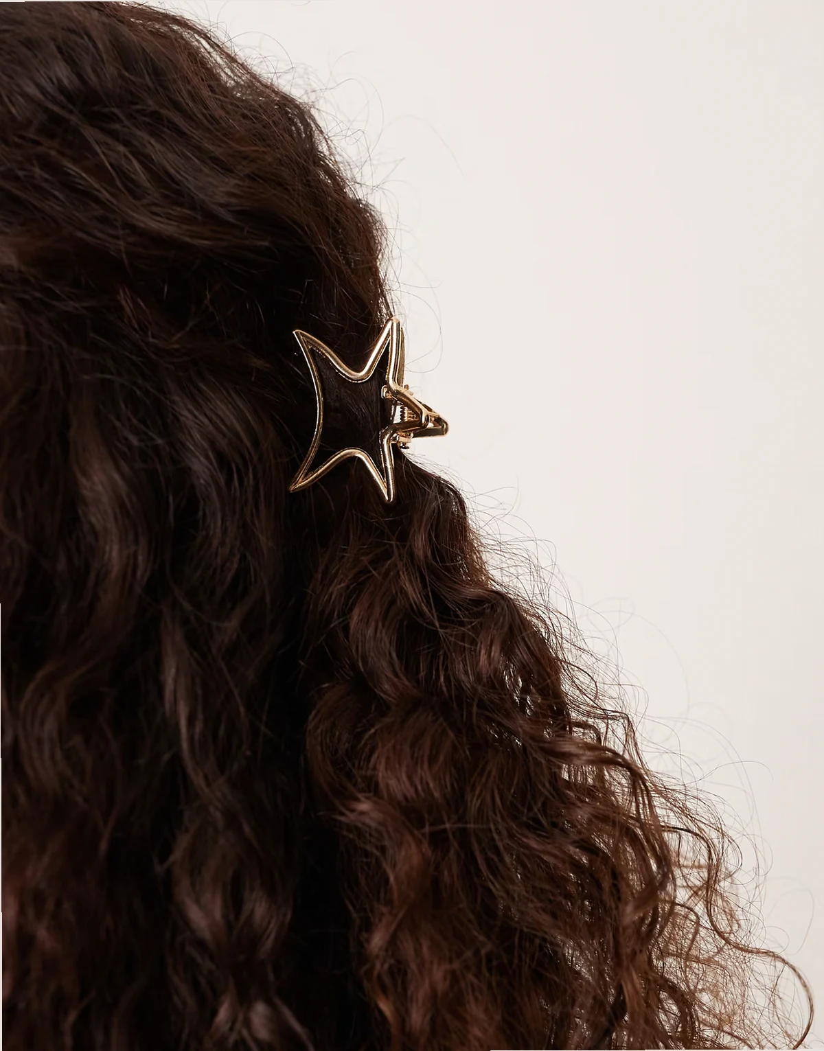 metal star claw clip in gold tone