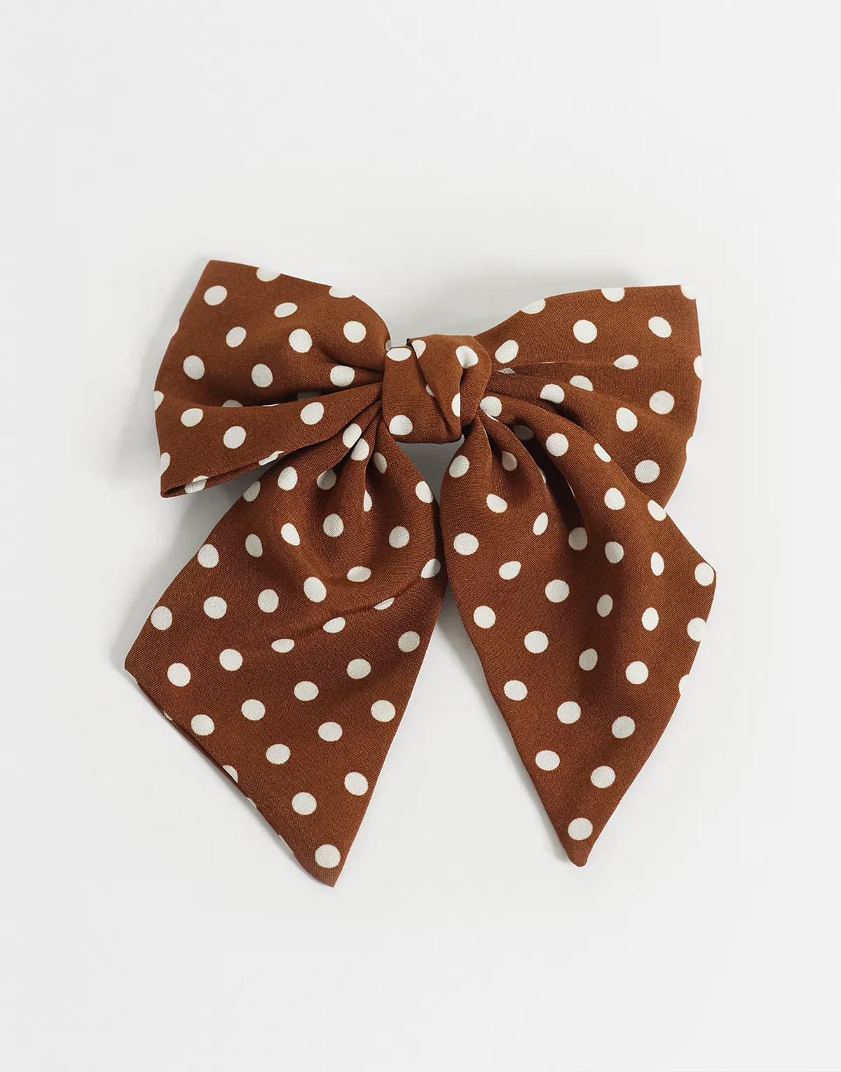 bow hair clip in brown polka dots