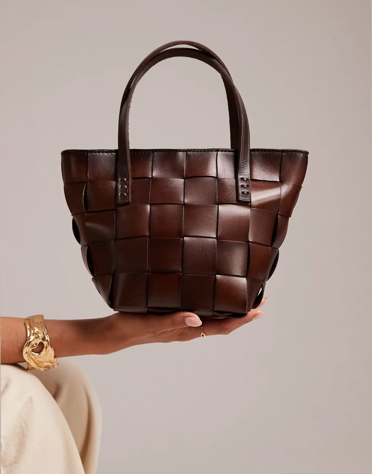 japan mini woven leather top handle bag in dark brown