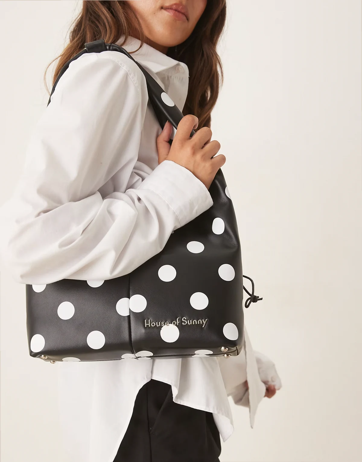 polka dot sling bag in black