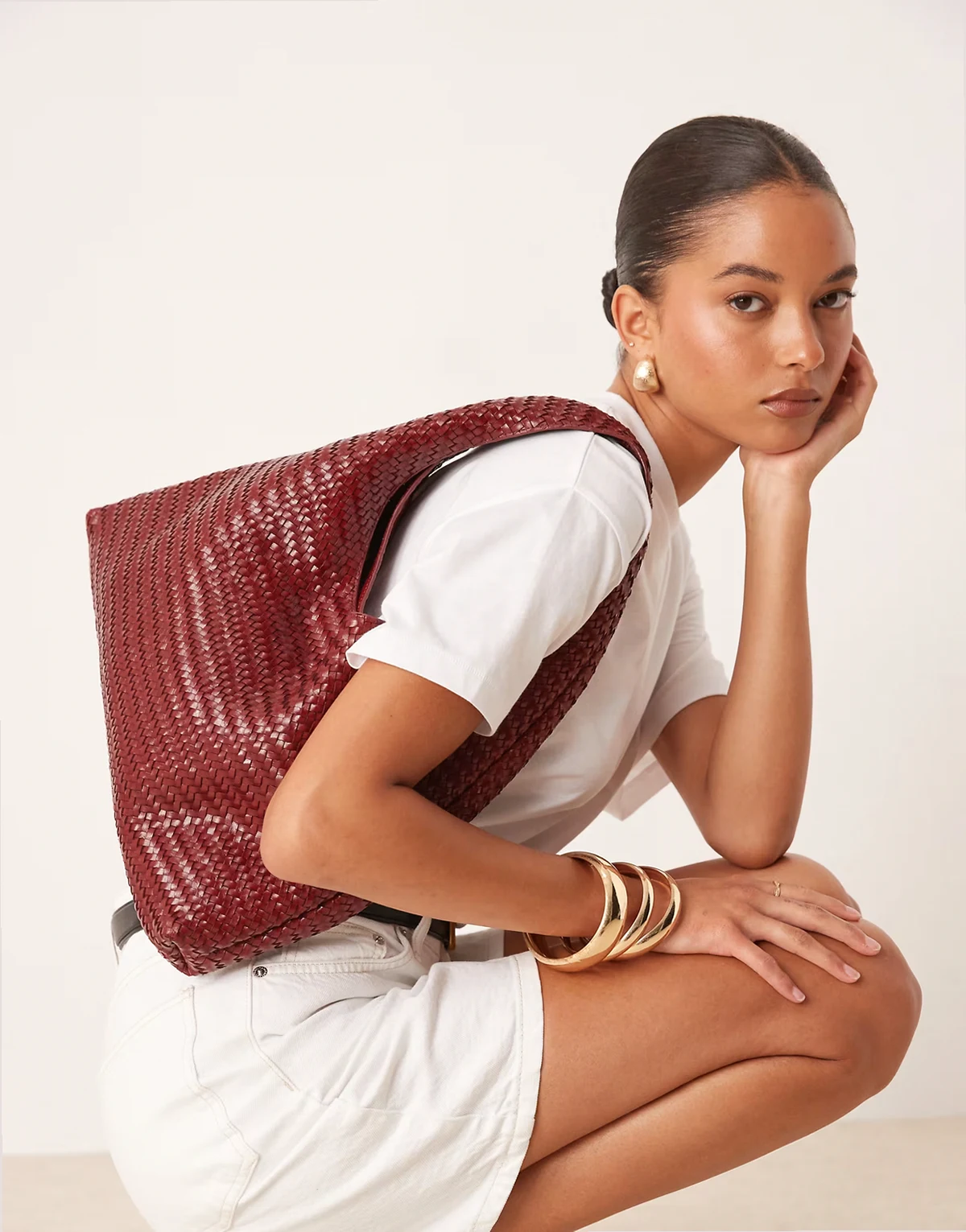 woven leather slouchy shoulder bag in cherry red