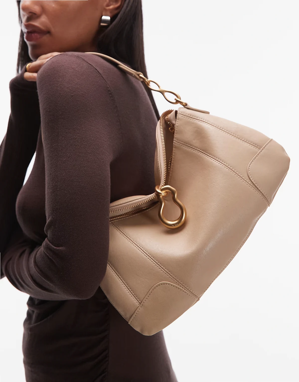 Jayla shoulder bag with molten buckle detailing in beige