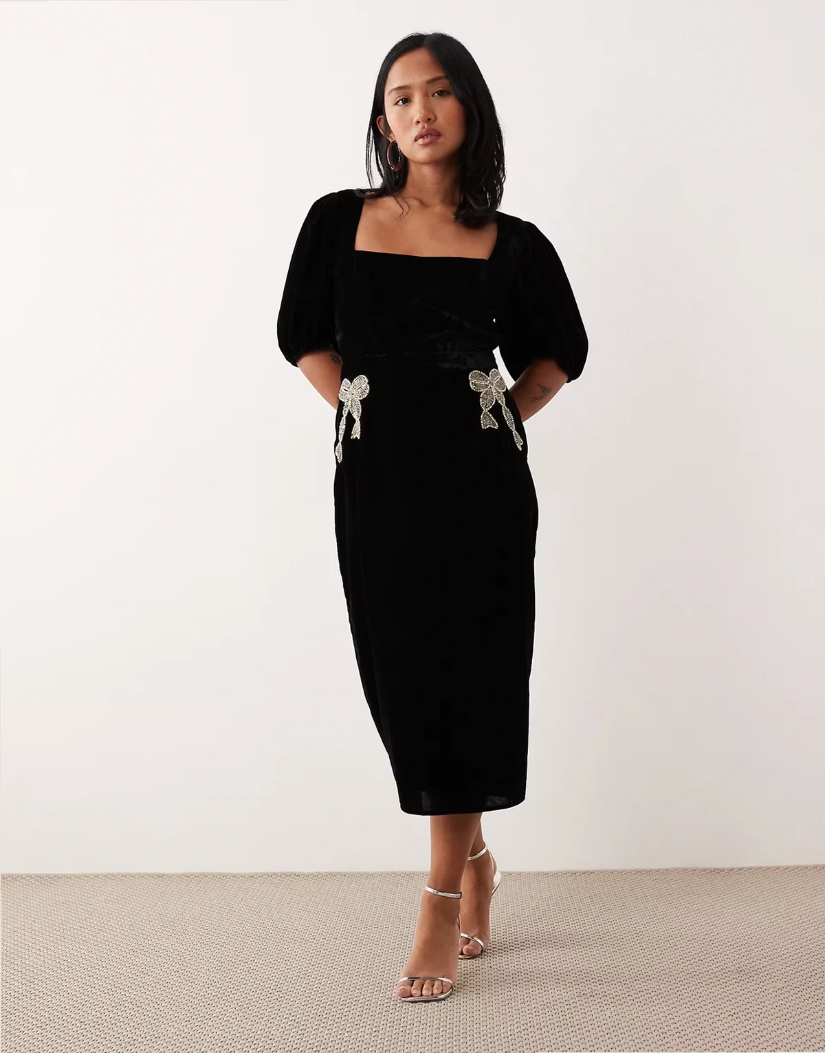 velvet midi dress with embellished bows in black