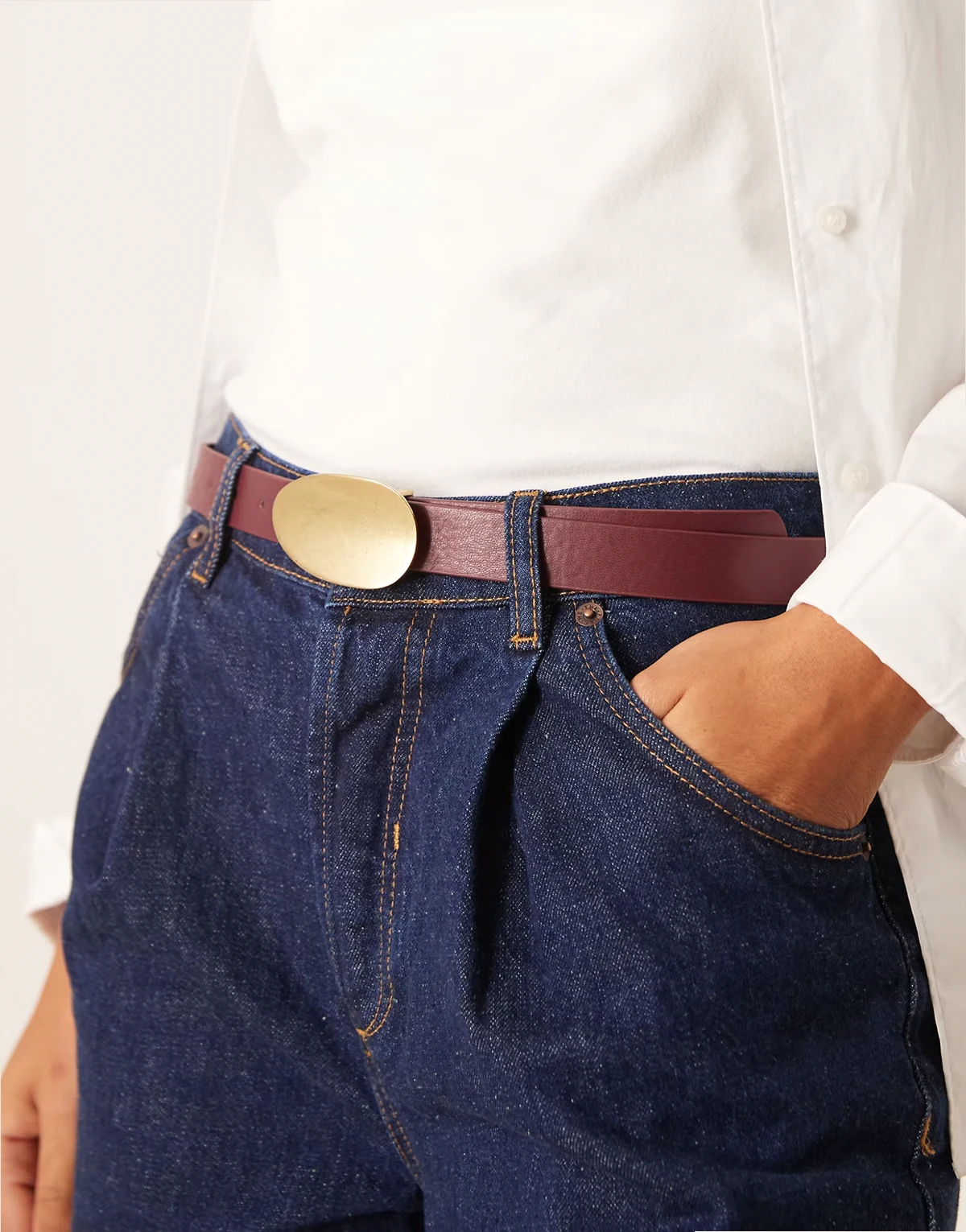 curved buckle belt in burgundy and gold