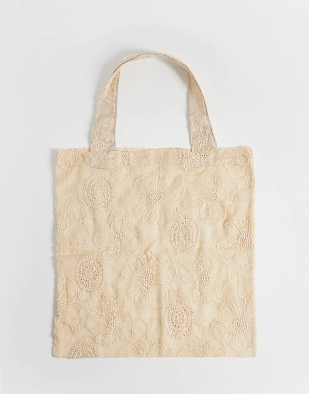 – Kamiennobeżowa prześwitująca torba typu tote w haftowany kwiatowy wzór
