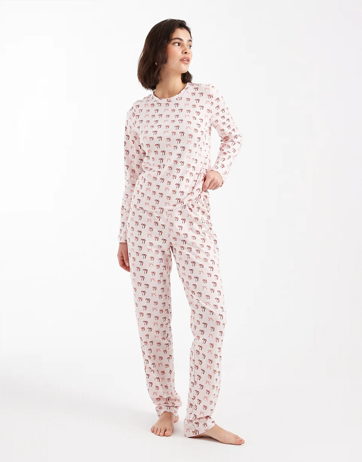 – Weihnachtlicher, langärmliger Pyjama in Rosa mit Schleifen-Muster