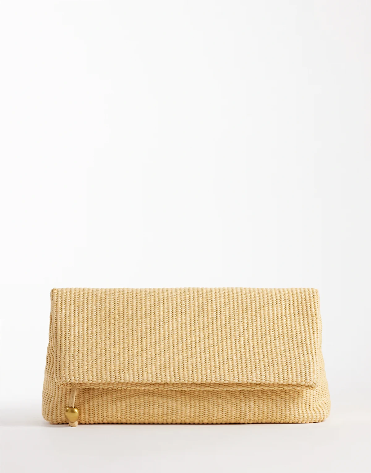 elongated straw clutch bag with ball hardware in natural