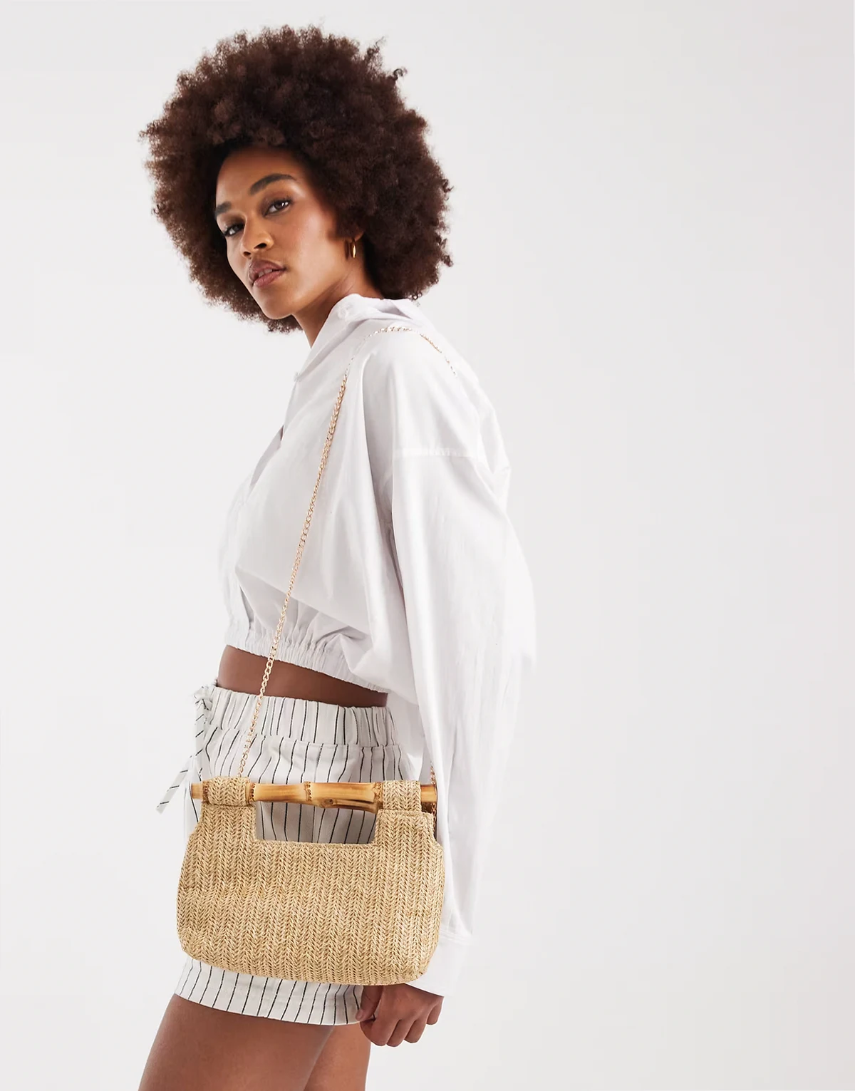 structured raffia purse with faux bamboo handle in neutral