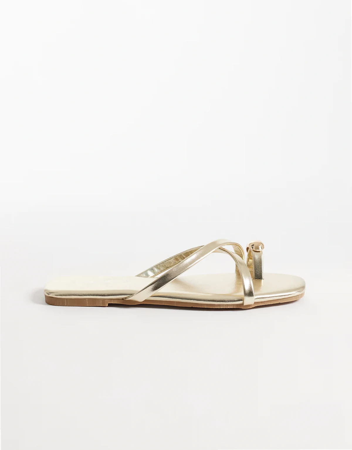 flat sandals with toe ring in gold