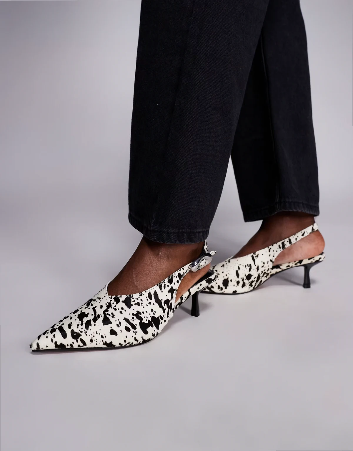 cow print slingback pumps in dark brown