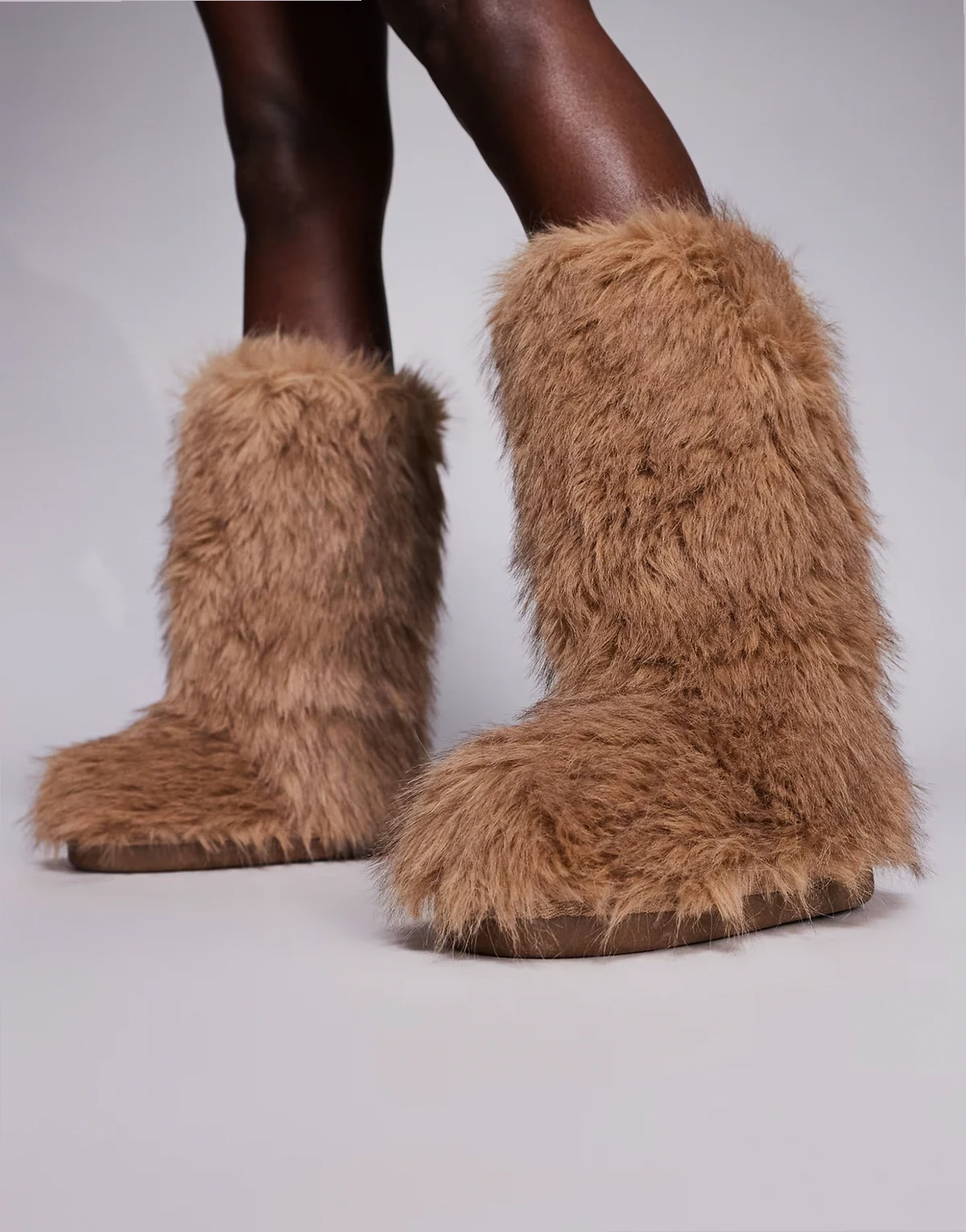 faux fur boots in light brown