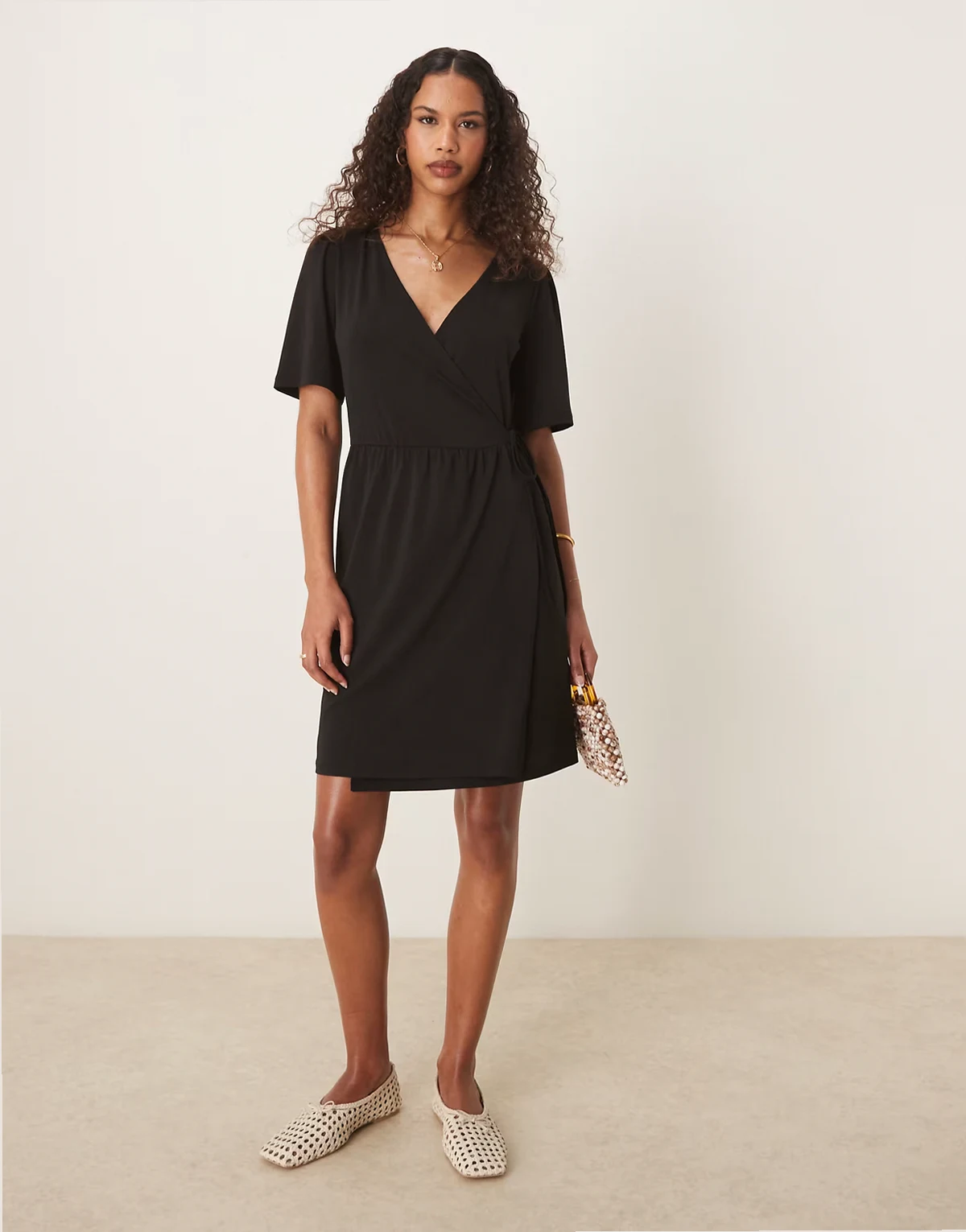 jersey wrap front tie side mini dress in black