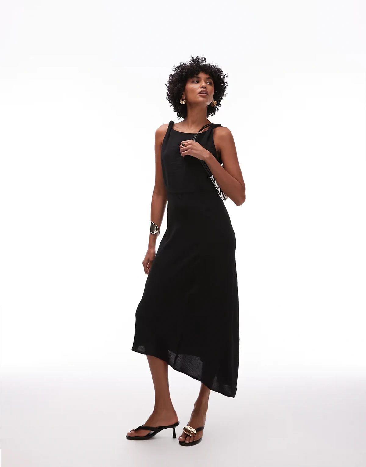– Asymmetrisches, ärmelloses Maxikleid in Schwarz