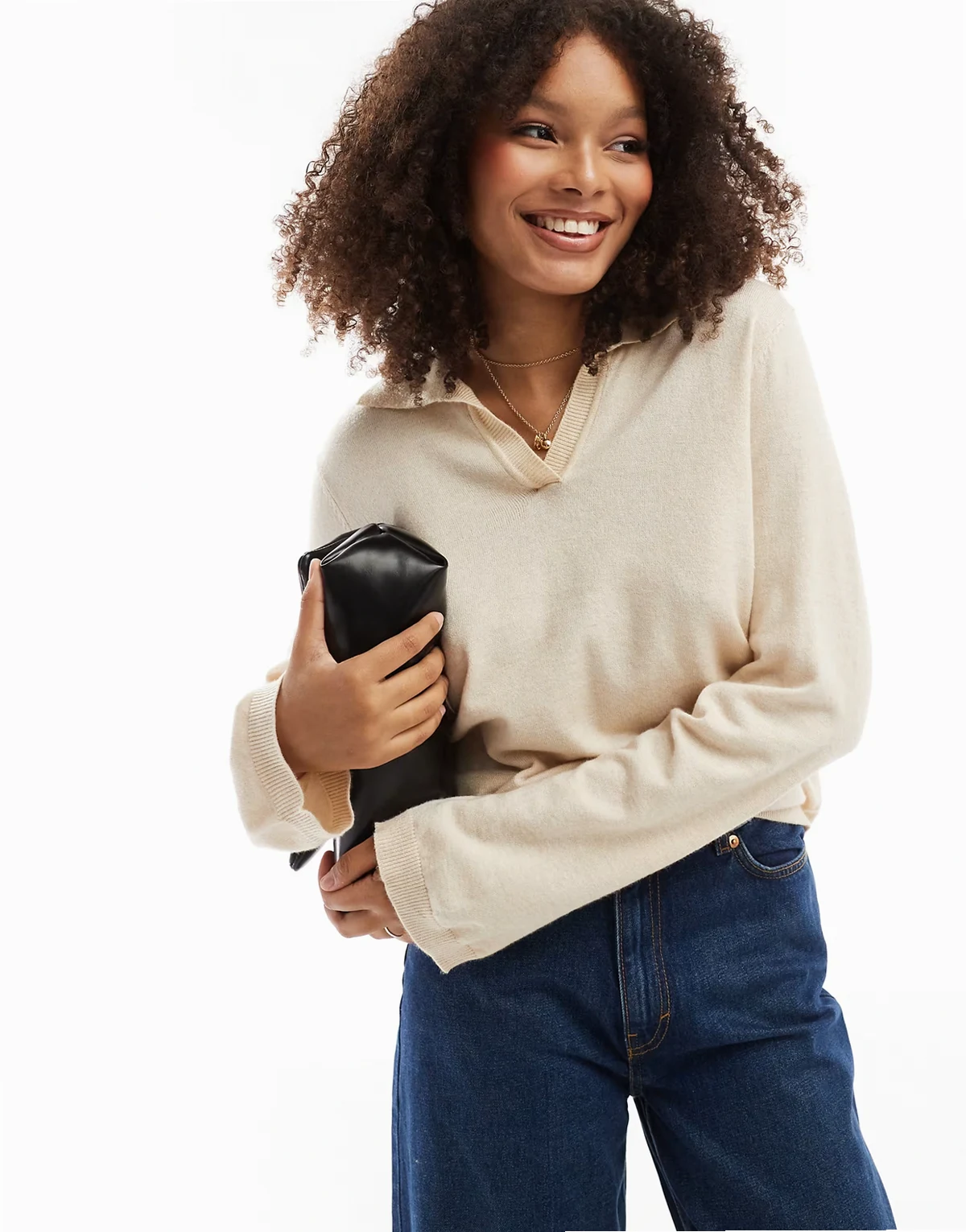 – Gestrickter Polopullover in Creme-Melange  mit V-Ausschnitt
