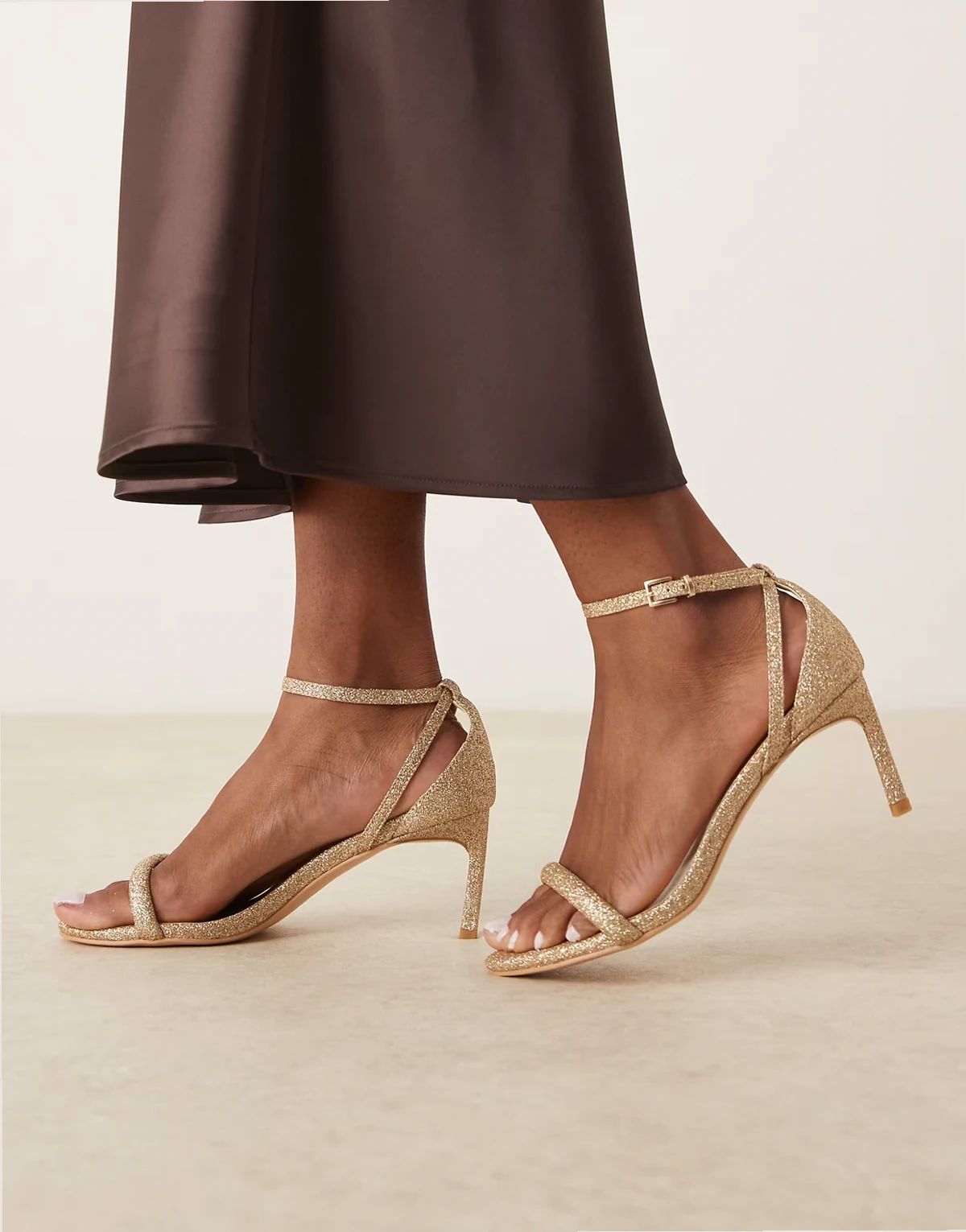 barely there heeled sandals in gold glitter