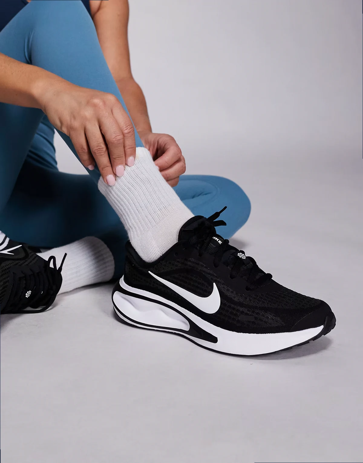 Nike Journey Run sneakers in black and white