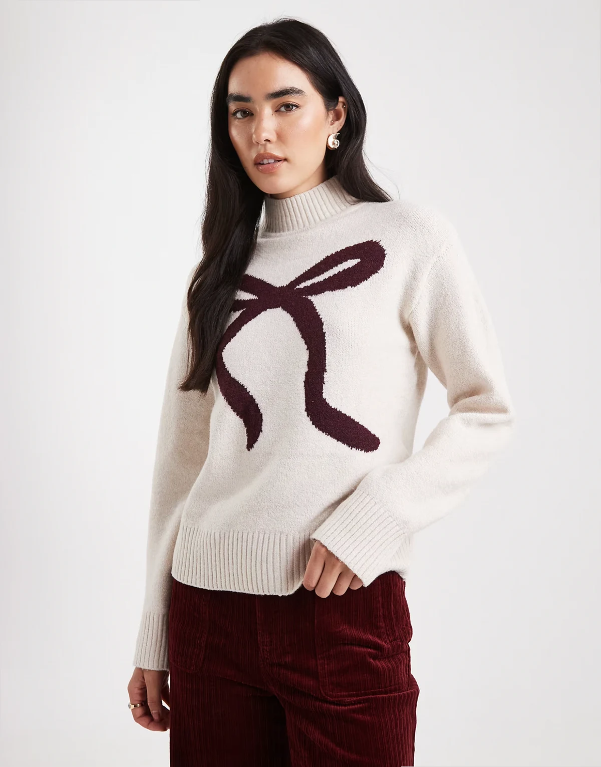 mock neck sweater with bow print in cream