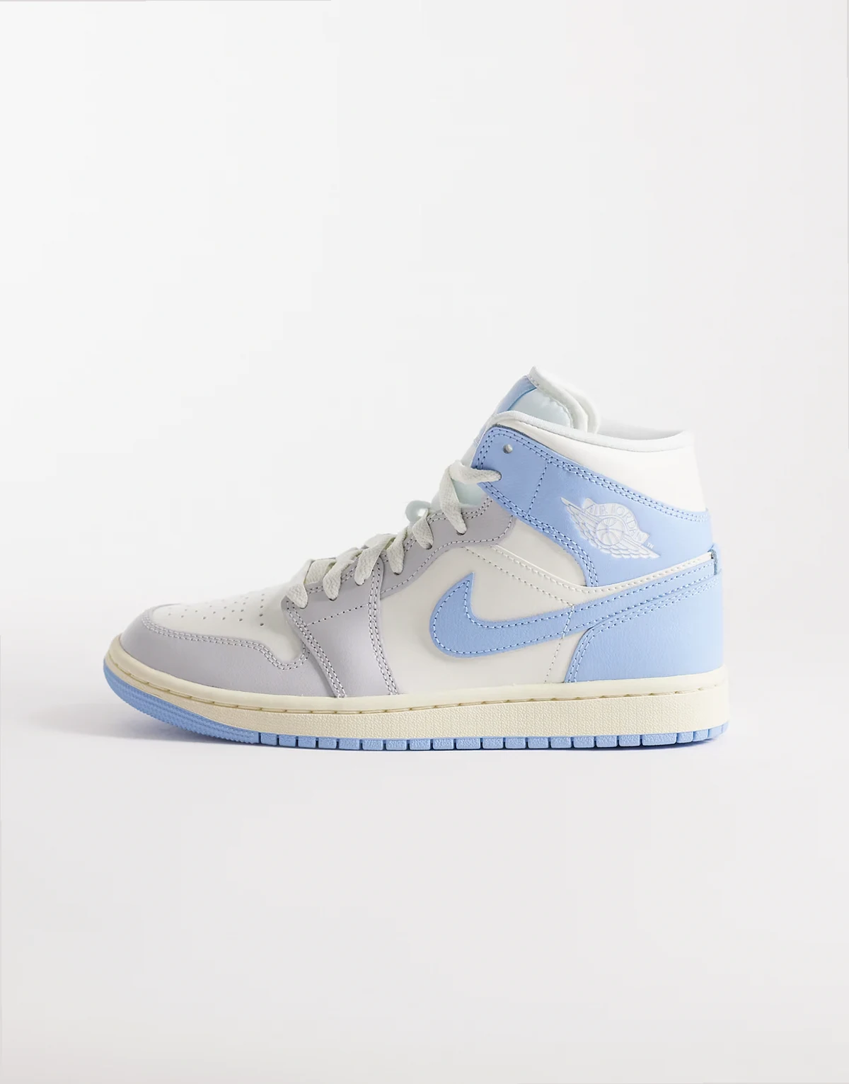 Nike Air Jordan 1 Mid sneakers in light blue and white