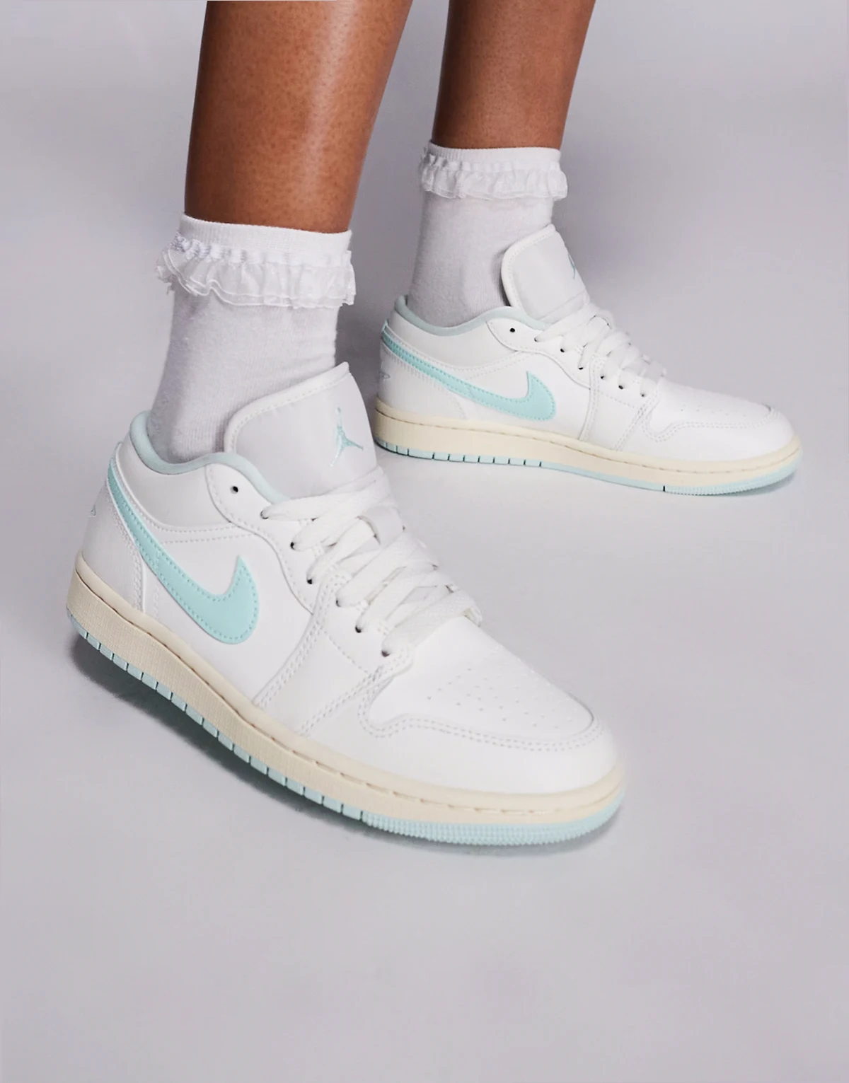 Nike Air Jordan 1 Low sneakers in white and light blue