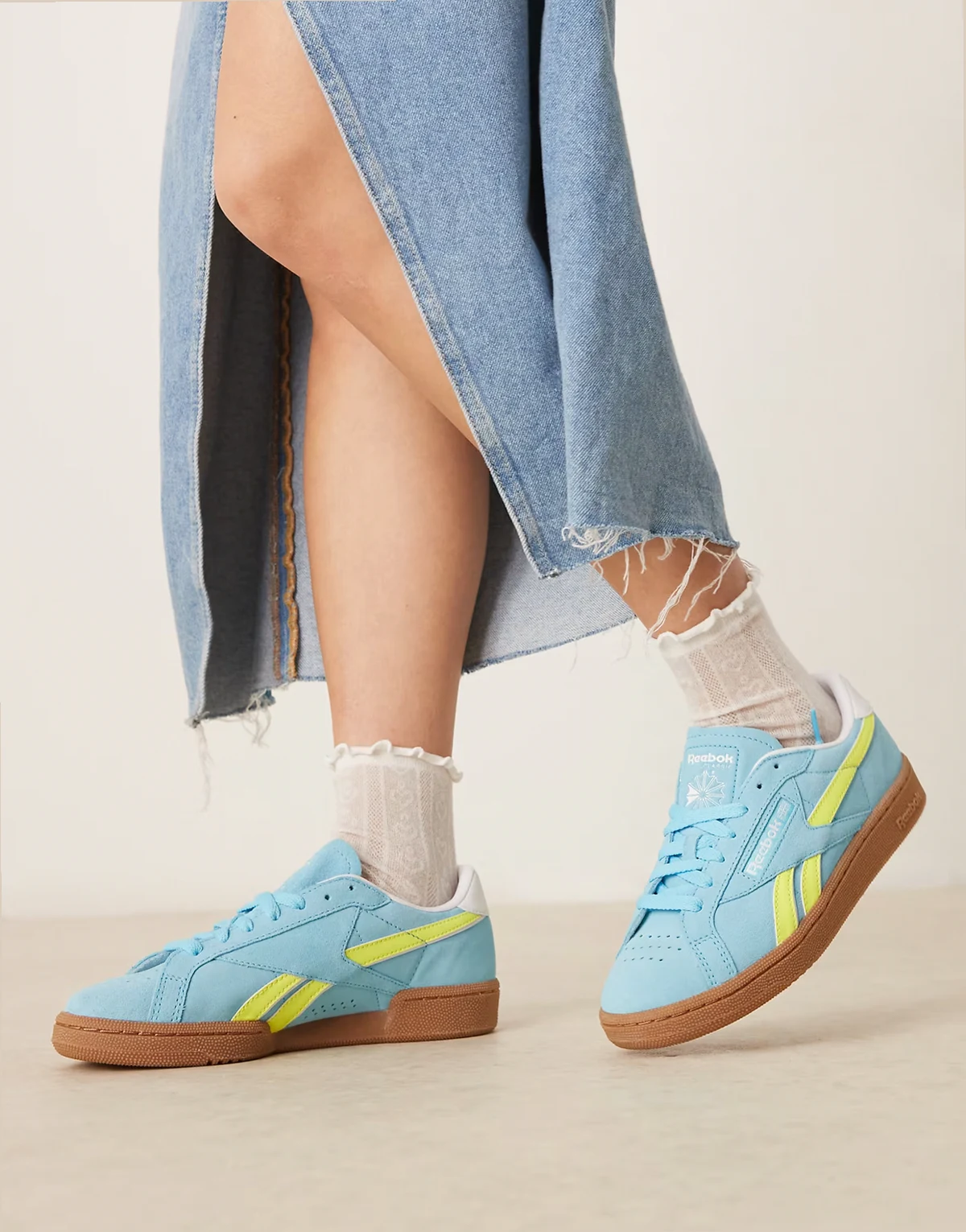 Club C Grounds sneakers in blue and yellow detail with gumsole