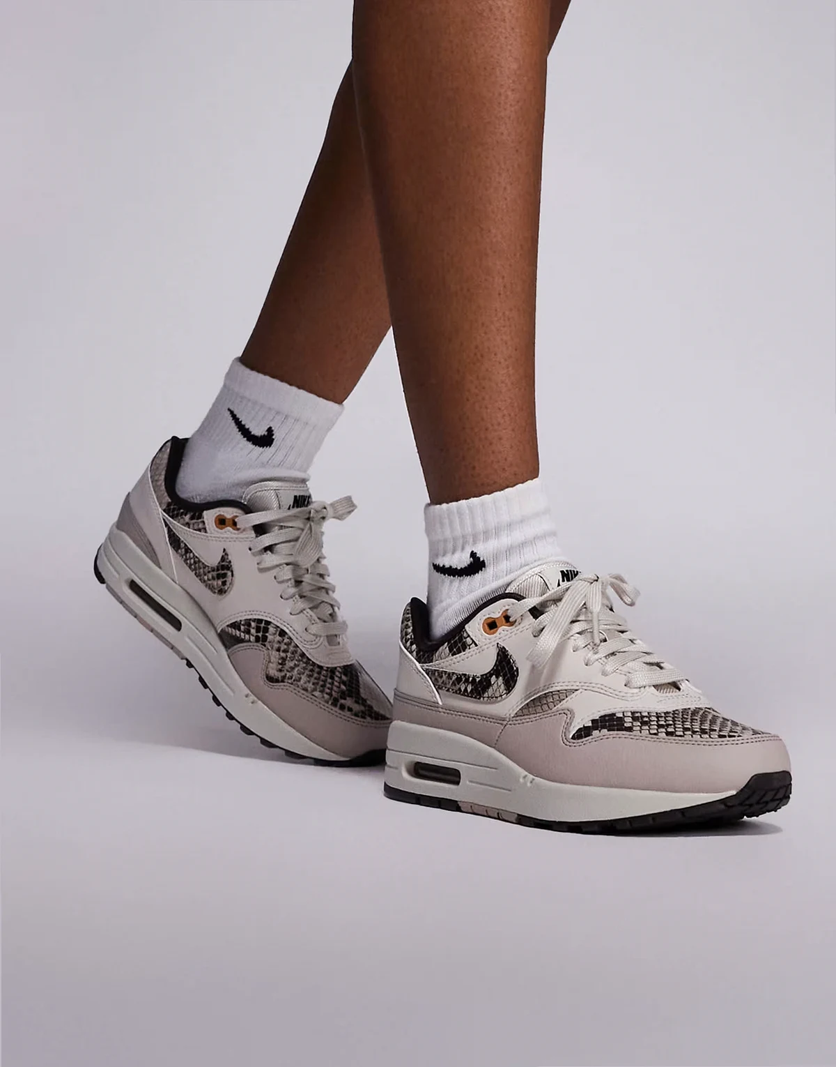 Air Max 1 sneakers in white and snake print