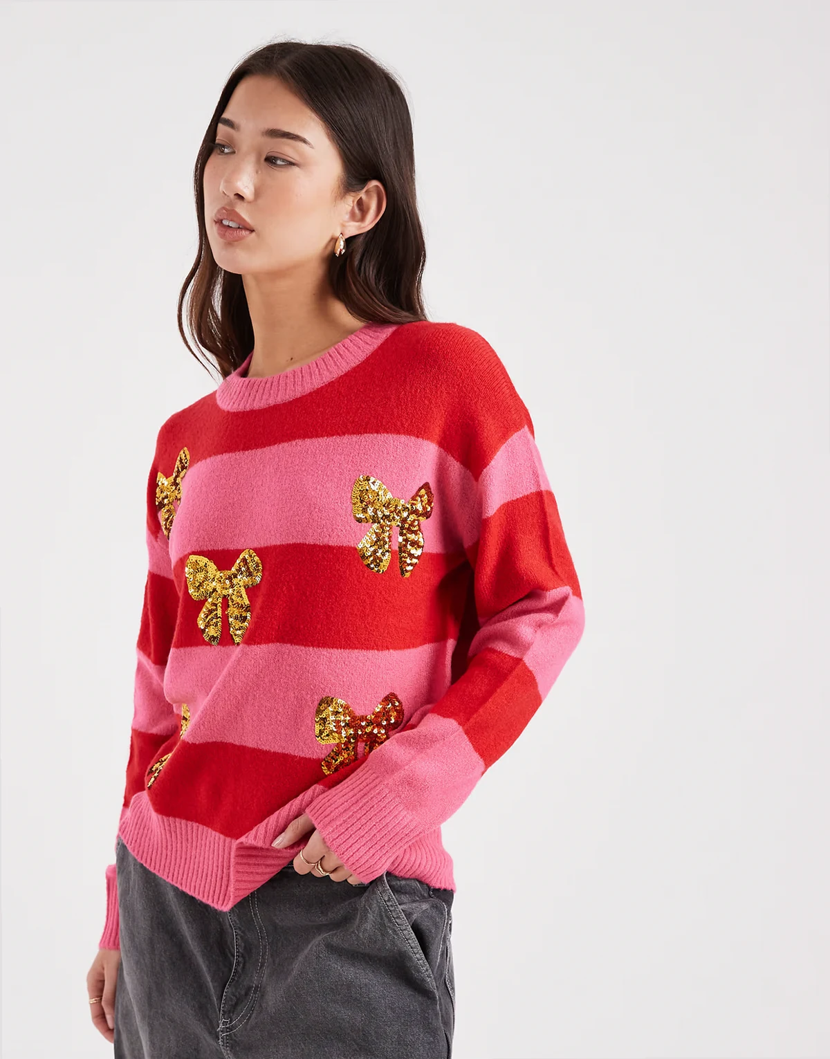 crew neck striped sweater with sequin bow detailing in pink and red