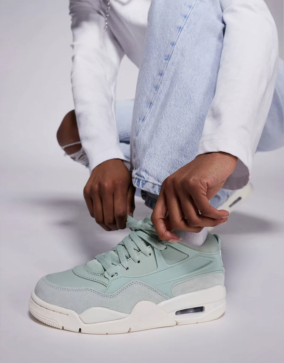 Nike Air Jordan 4 RM sneakers in light green and white