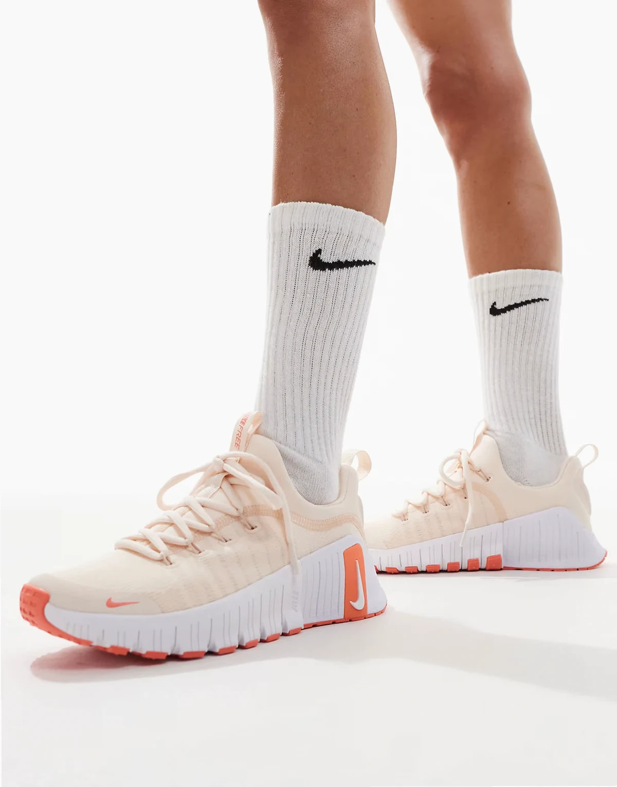 Free Metcon 6 sneakers in light orange and white