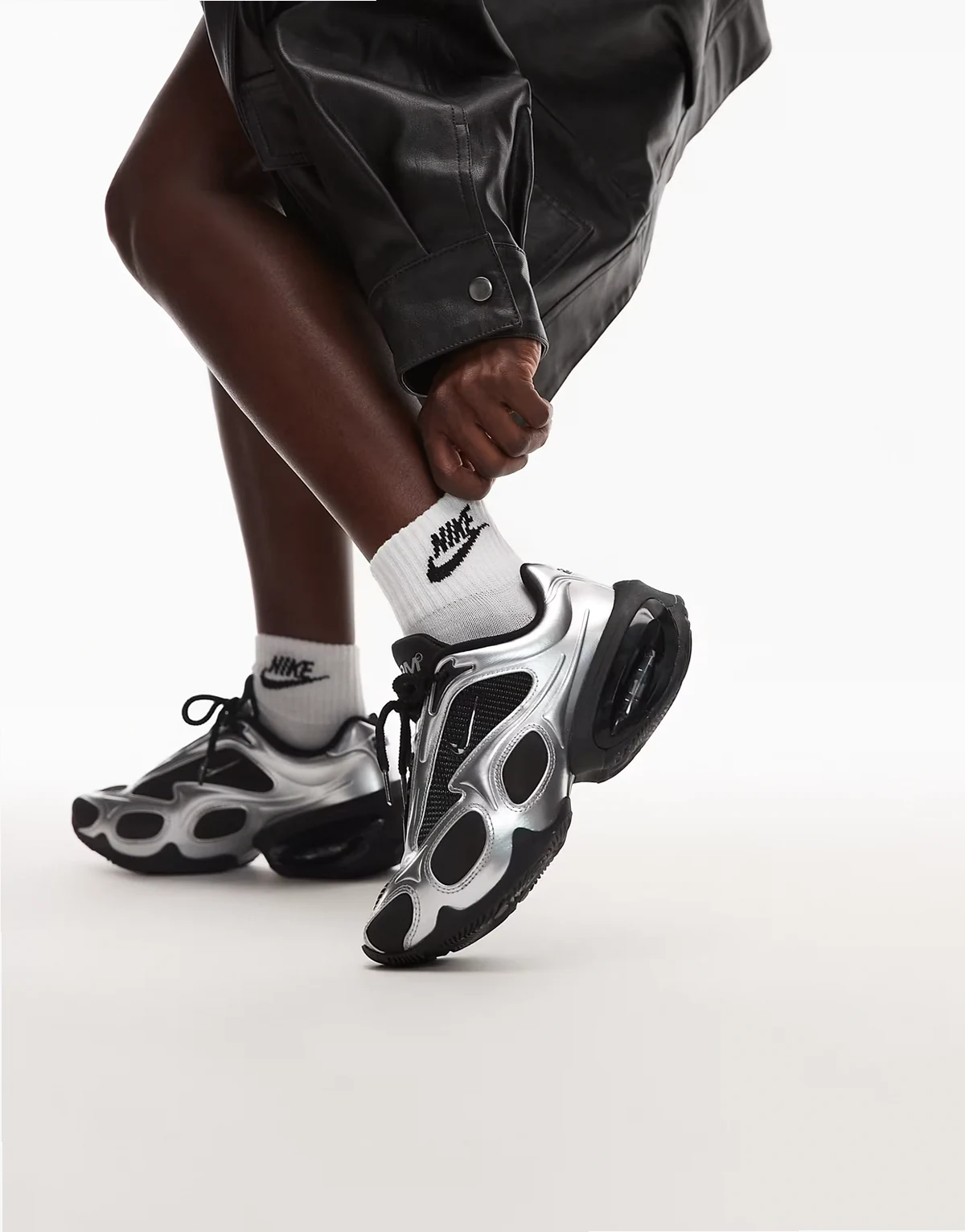 Air Max Muse sneakers in black and metallic silver