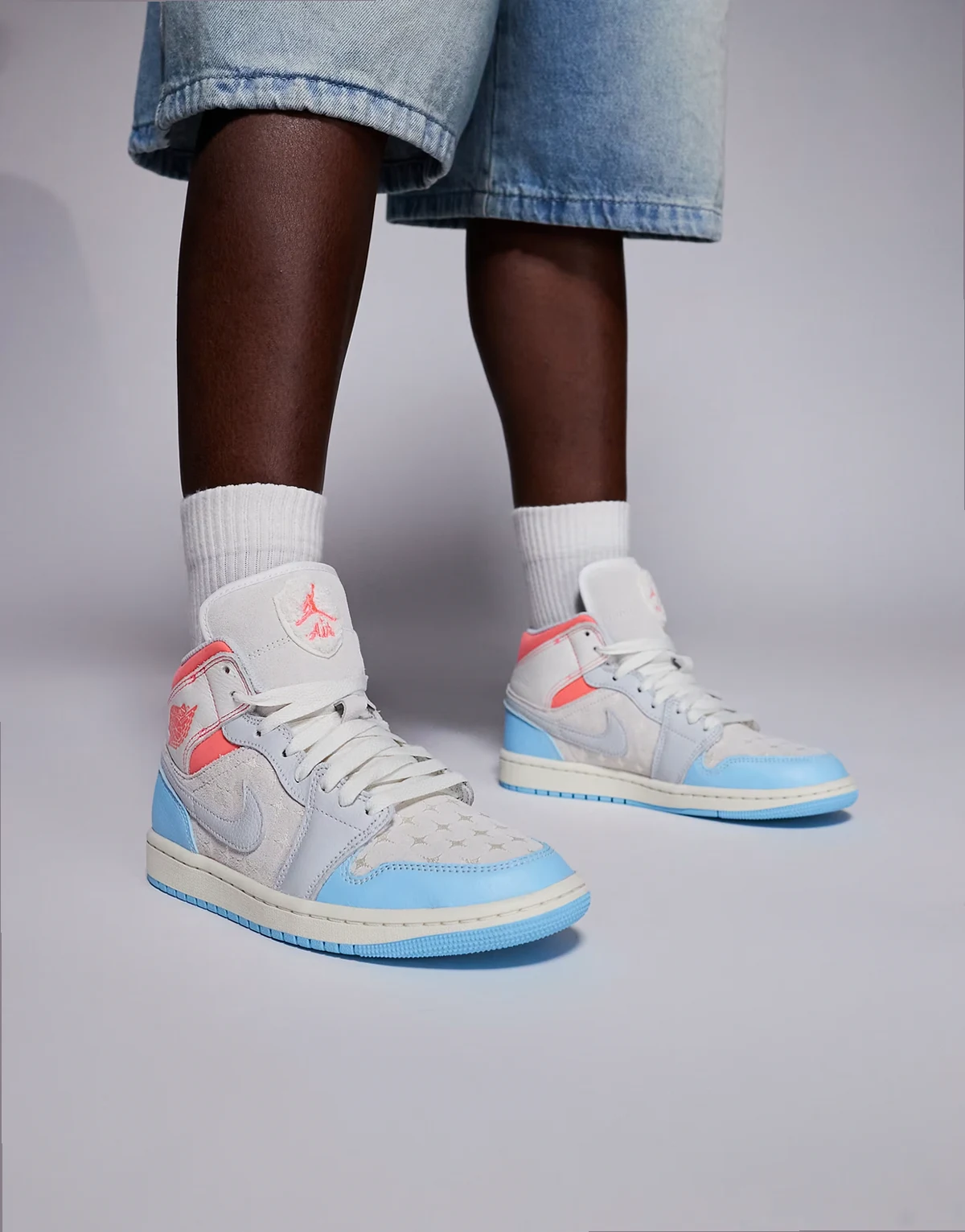 Nike Air Jordan 1 Mid NA4 sneakers in off white, pink and blue