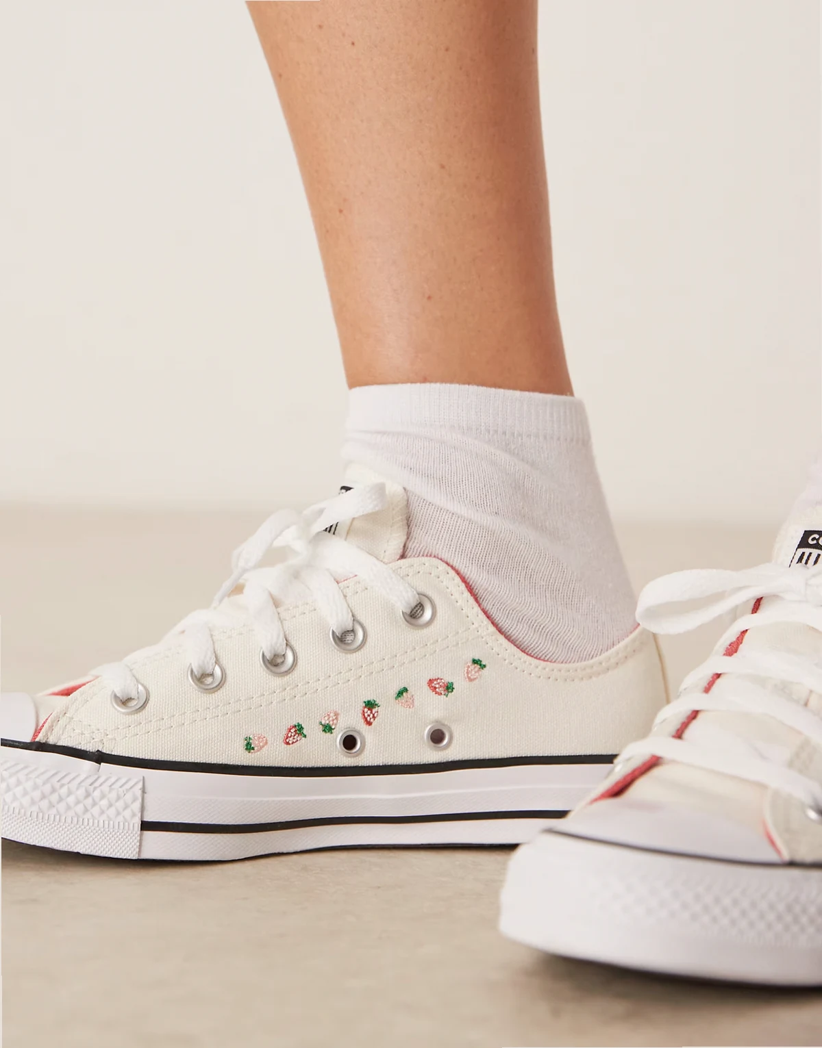 Chuck Taylor All Star sneakers in white with strawberry detailing