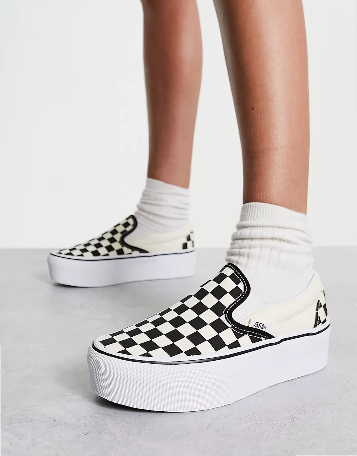Classic Slip-On Stackform checkerboard sneakers in black and white