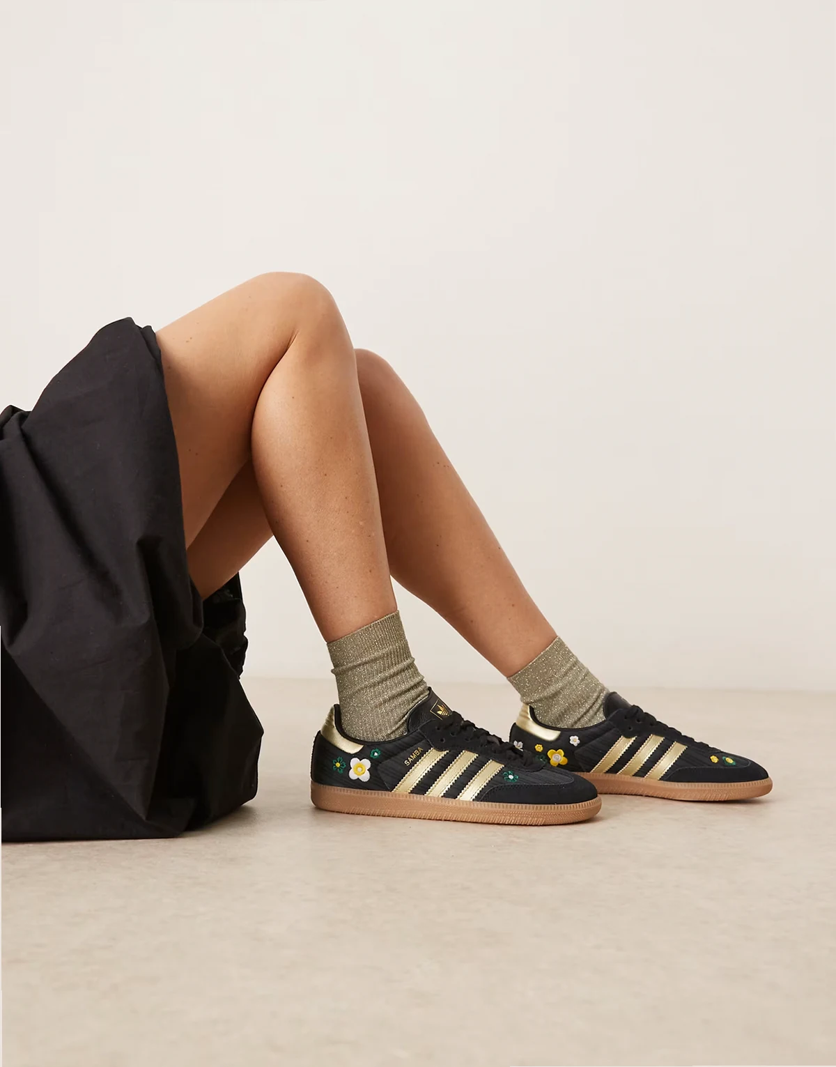 Samba OG sneakers with flower detailing in black and gold