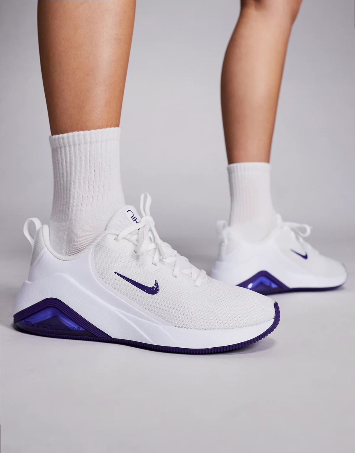 Nike Bella 7 sneakers in white & purple