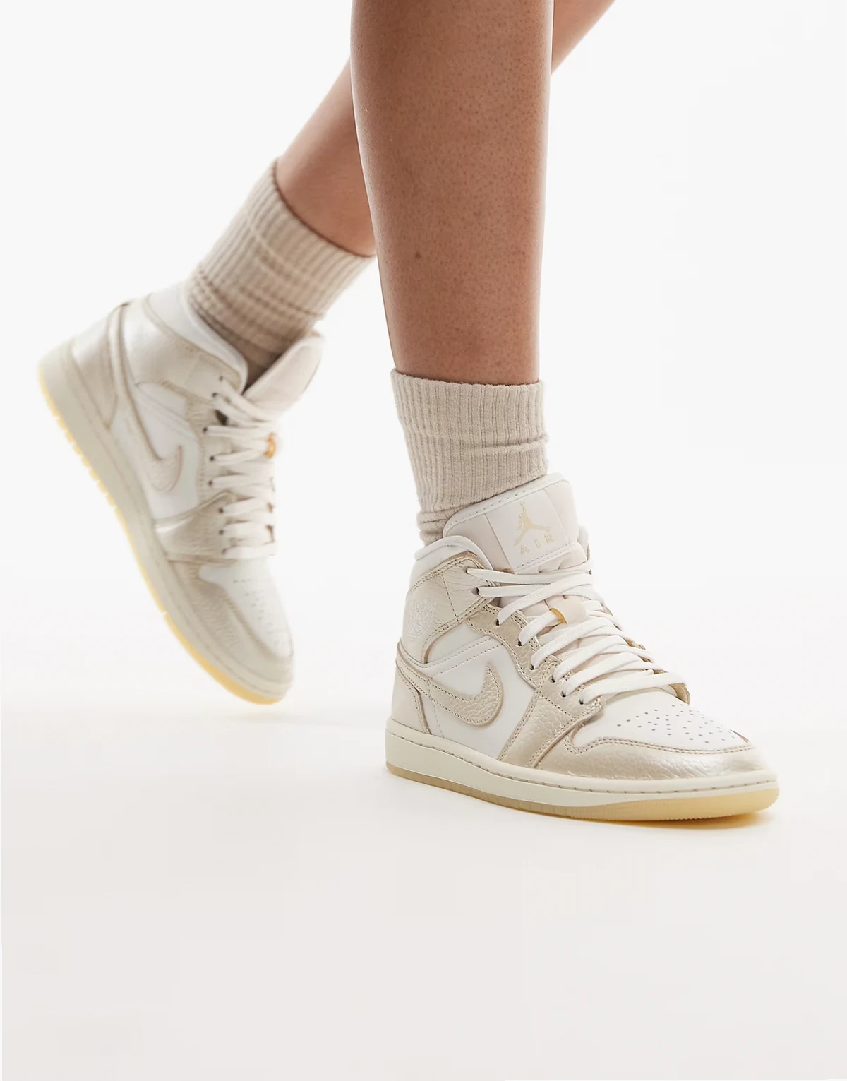 Nike Air Jordan 1 Mid sneakers in white and gold
