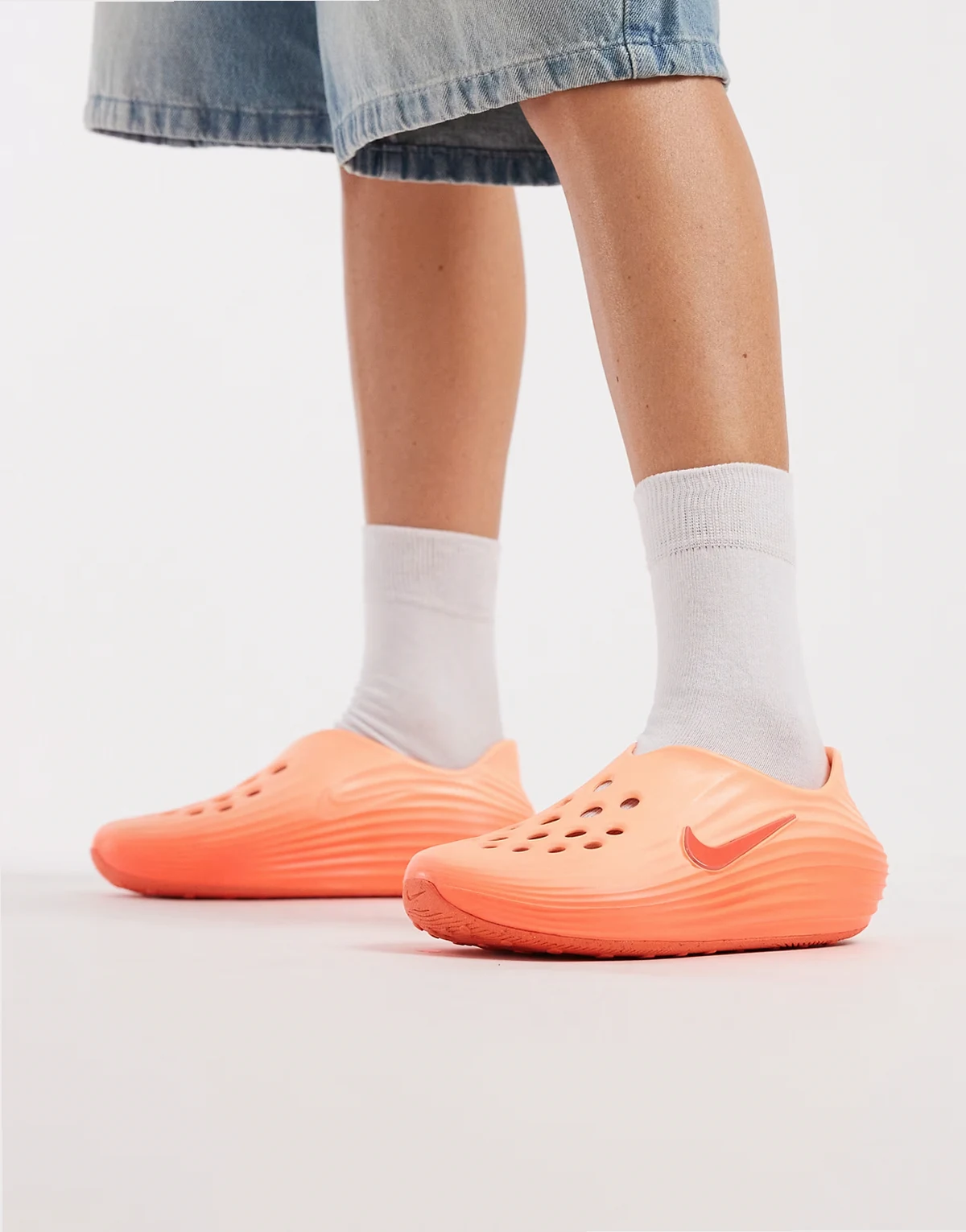 ReactX Rejuven8 clogs in orange and pink